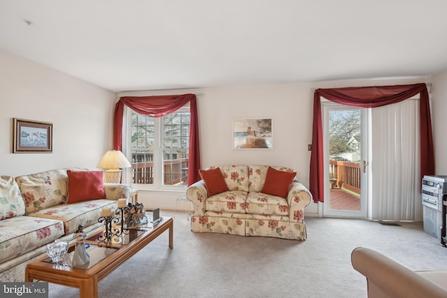 living room with carpet and plenty of natural light