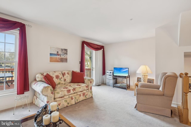 living room with light carpet and a wealth of natural light