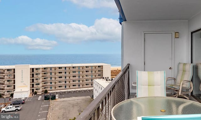 balcony featuring a water view