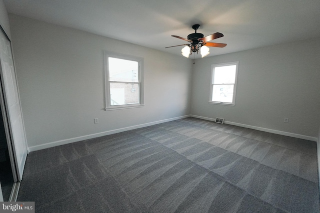 carpeted empty room with ceiling fan