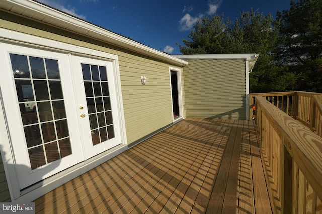 wooden deck featuring french doors