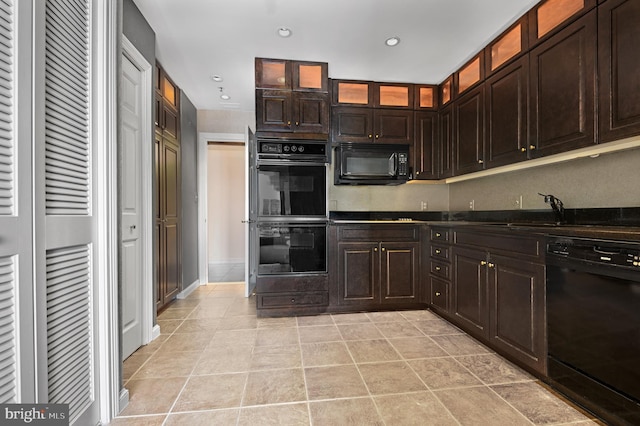 kitchen featuring light tile patterned flooring, dark brown cabinets, sink, and black appliances