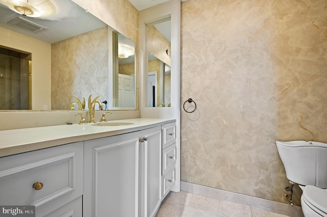 bathroom with vanity and toilet