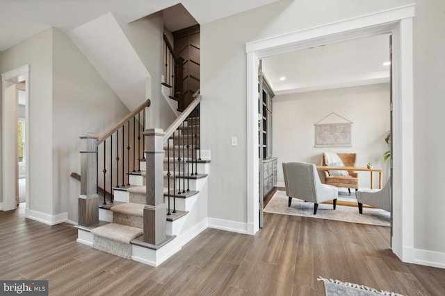 stairway featuring hardwood / wood-style flooring