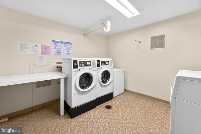 laundry room featuring washer and clothes dryer