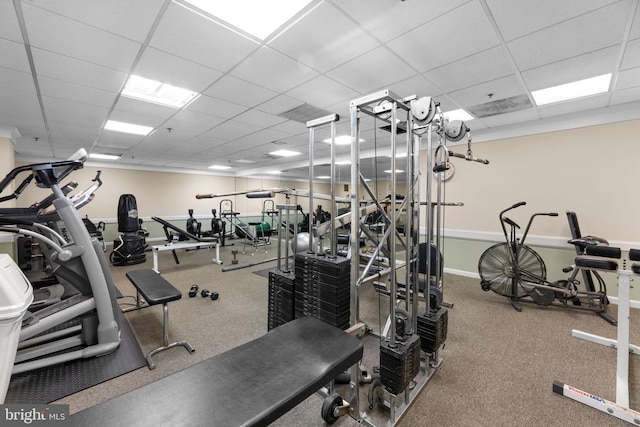 gym featuring a paneled ceiling