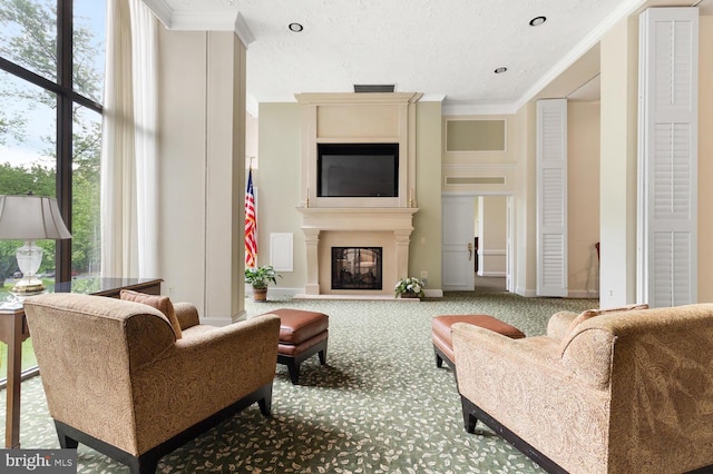 carpeted living room with a large fireplace and ornamental molding