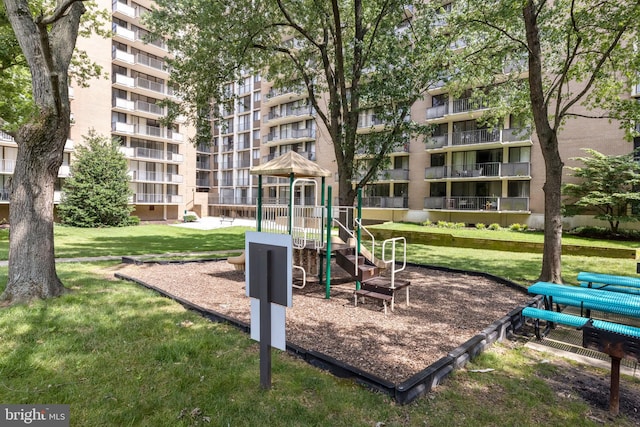 view of community with a playground and a lawn