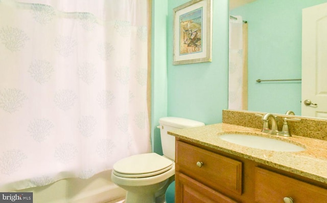 bathroom with toilet and vanity