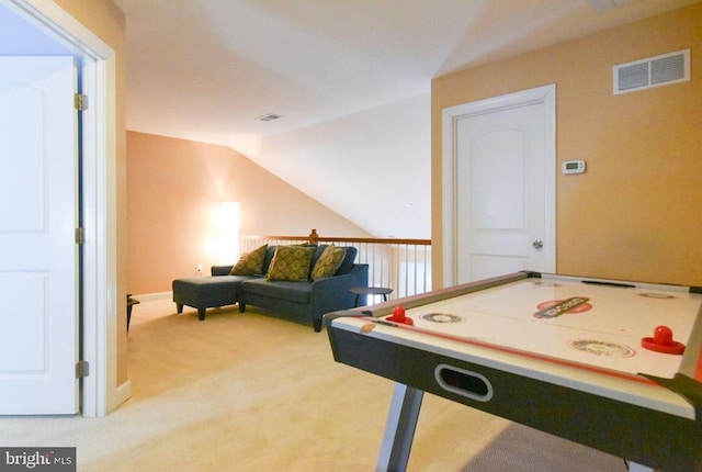 playroom featuring carpet floors and lofted ceiling