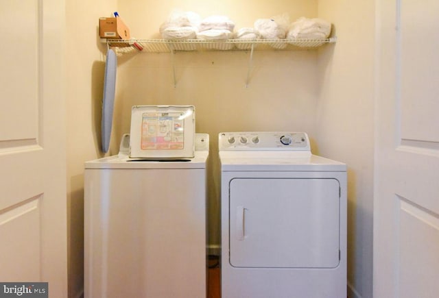 washroom featuring independent washer and dryer