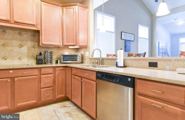 kitchen with tasteful backsplash, decorative light fixtures, lofted ceiling, stainless steel dishwasher, and sink