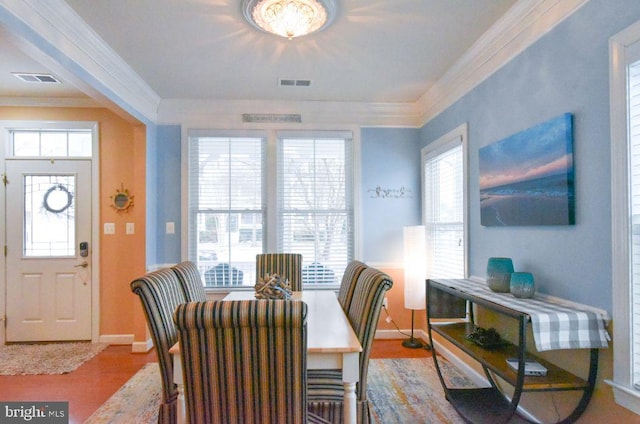 dining space with hardwood / wood-style floors and crown molding