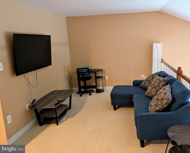 living room featuring light colored carpet and lofted ceiling