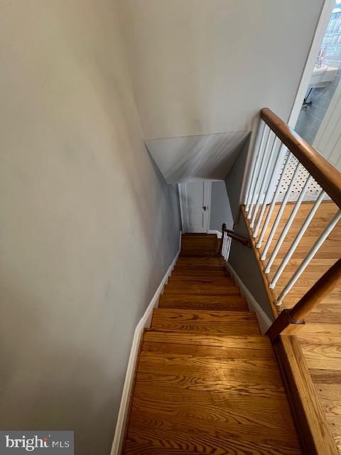 stairway with wood-type flooring