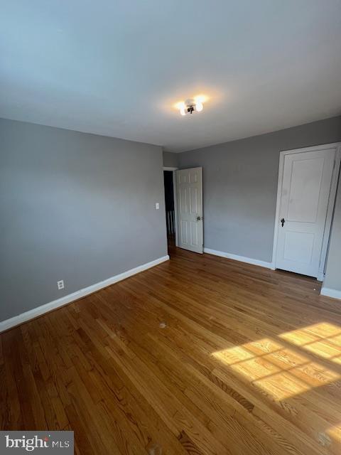 spare room with light hardwood / wood-style floors