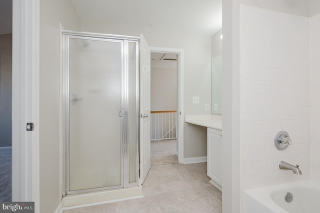 bathroom featuring plus walk in shower and vanity