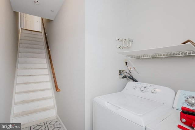 clothes washing area featuring washer and dryer