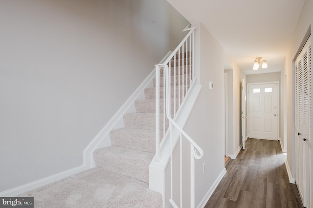 staircase featuring hardwood / wood-style flooring