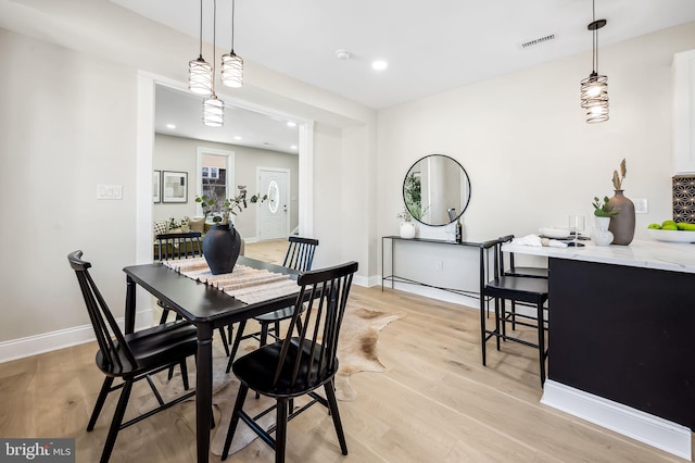 dining area with light hardwood / wood-style flooring