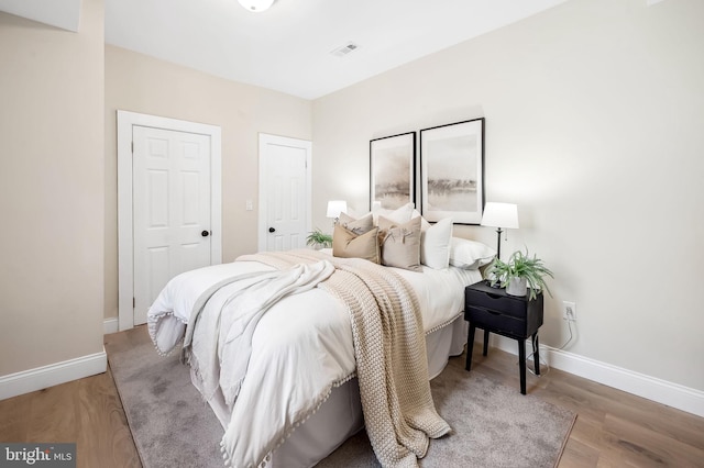 bedroom with wood-type flooring