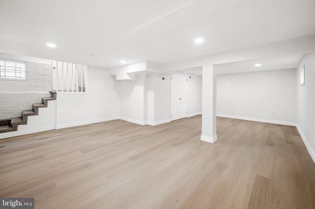 basement featuring light hardwood / wood-style floors