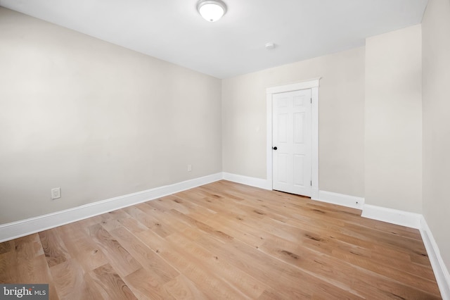 spare room with light hardwood / wood-style floors