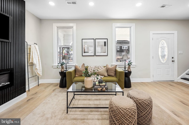 living room with light hardwood / wood-style floors