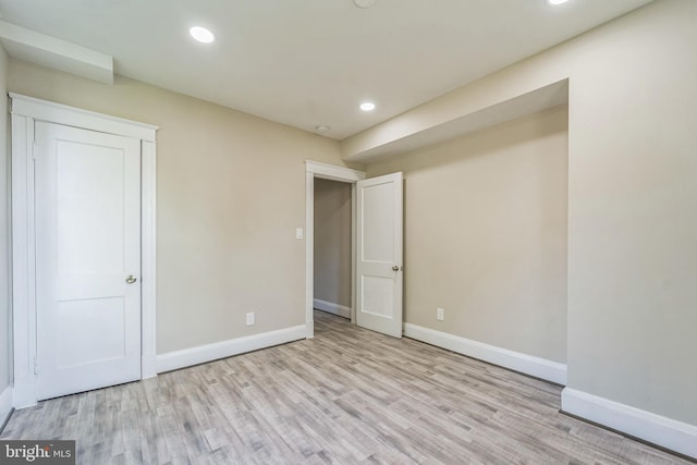 unfurnished bedroom featuring light hardwood / wood-style floors