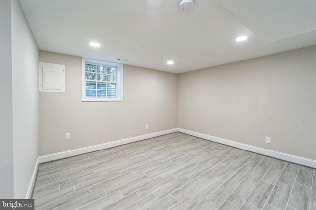 spare room with light hardwood / wood-style flooring