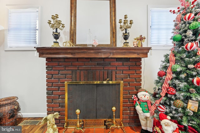 details featuring a fireplace and hardwood / wood-style flooring