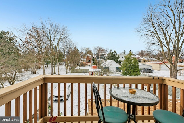 view of snow covered deck