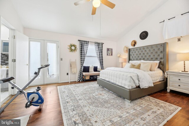 bedroom featuring french doors, dark hardwood / wood-style flooring, access to outside, vaulted ceiling, and ceiling fan