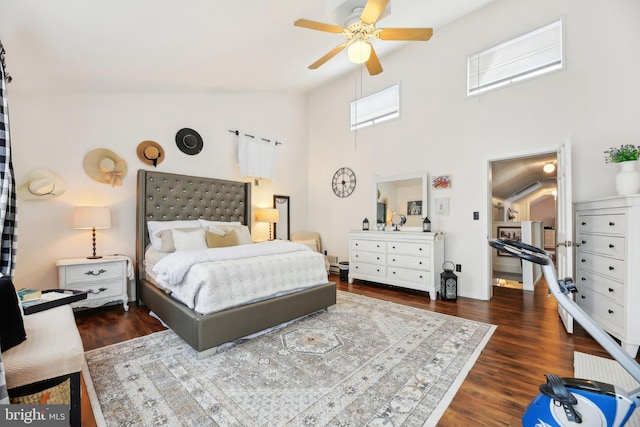 bedroom featuring a high ceiling, dark hardwood / wood-style floors, and ceiling fan