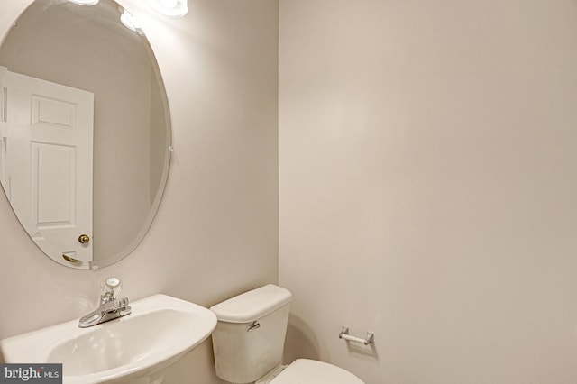 bathroom with toilet and sink