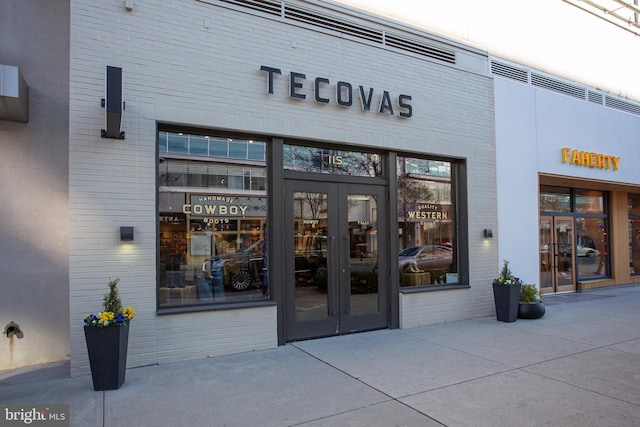 view of exterior entry featuring french doors