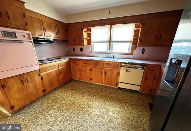 kitchen with white appliances and sink