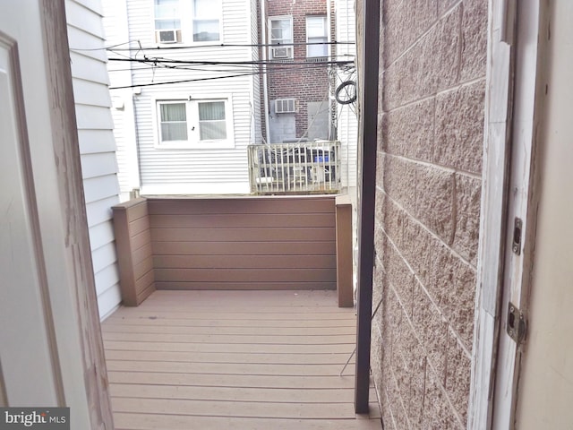 balcony featuring an AC wall unit