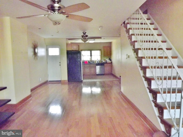 unfurnished living room with wood-type flooring