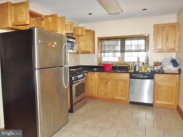 kitchen featuring appliances with stainless steel finishes and sink