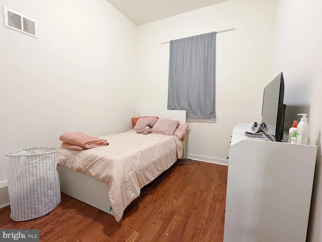 bedroom featuring wood-type flooring