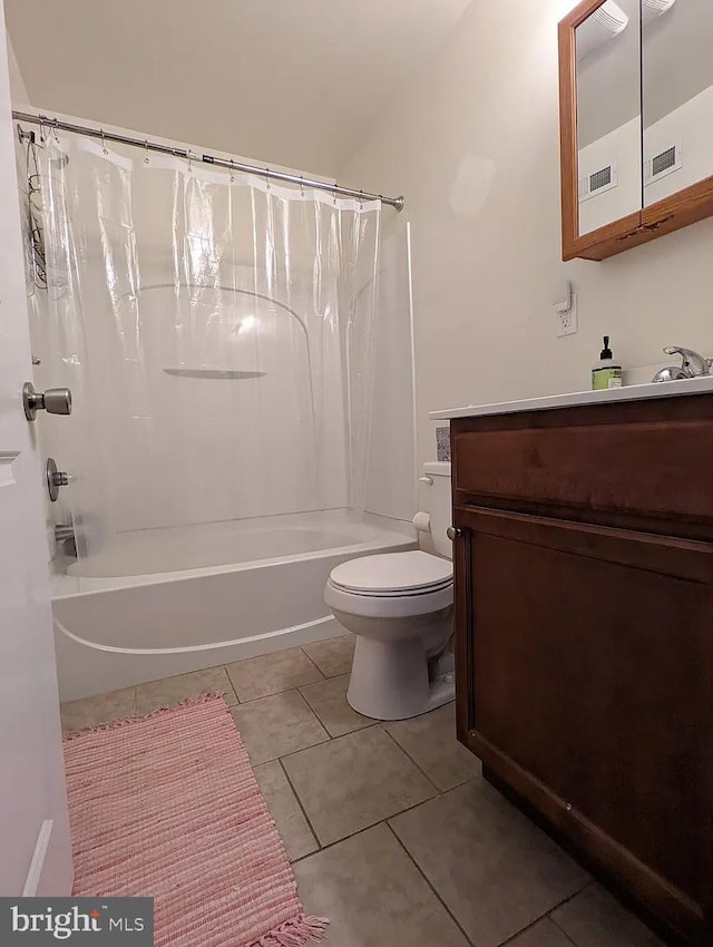 full bathroom featuring tile patterned floors, vanity, toilet, and shower / bathtub combination with curtain