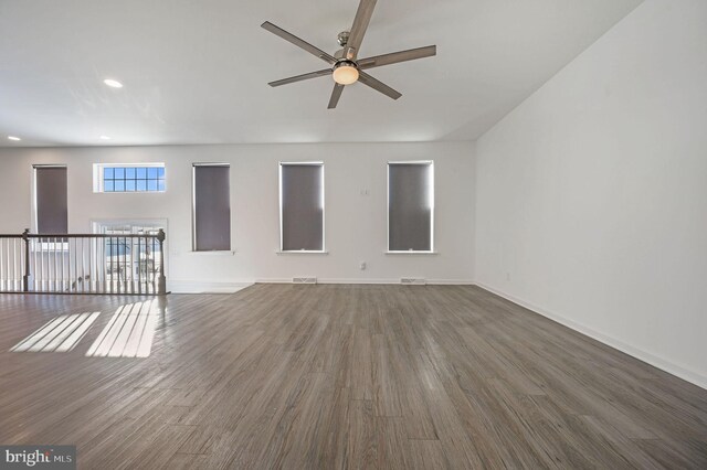 unfurnished living room featuring recessed lighting, wood finished floors, baseboards, and ceiling fan