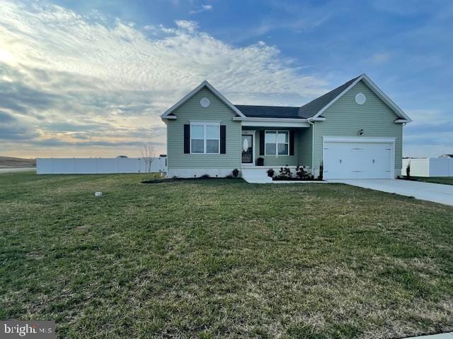 ranch-style home with an attached garage, concrete driveway, a front lawn, and fence