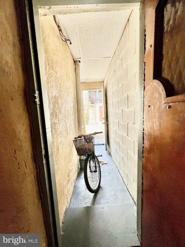 corridor with concrete flooring