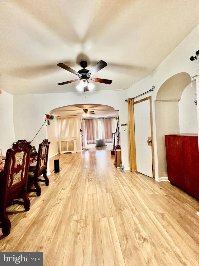 interior space with ceiling fan and light hardwood / wood-style floors