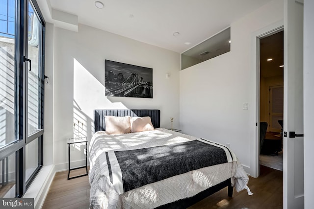 bedroom featuring wood-type flooring