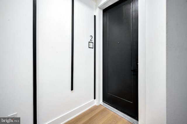 interior details featuring hardwood / wood-style flooring