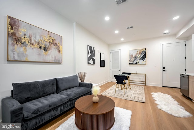 living room with light hardwood / wood-style flooring