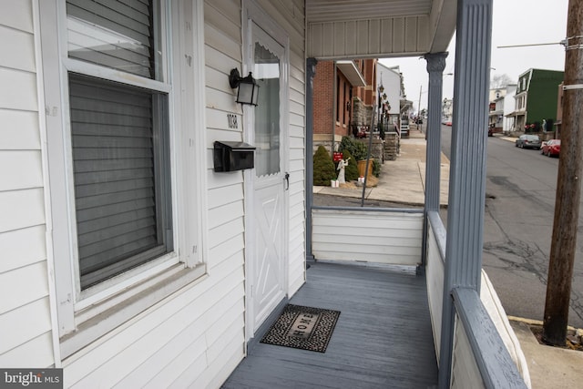 property entrance with covered porch